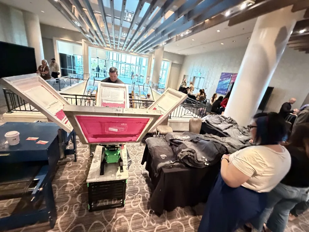 Screen printing equipment operating in an event space